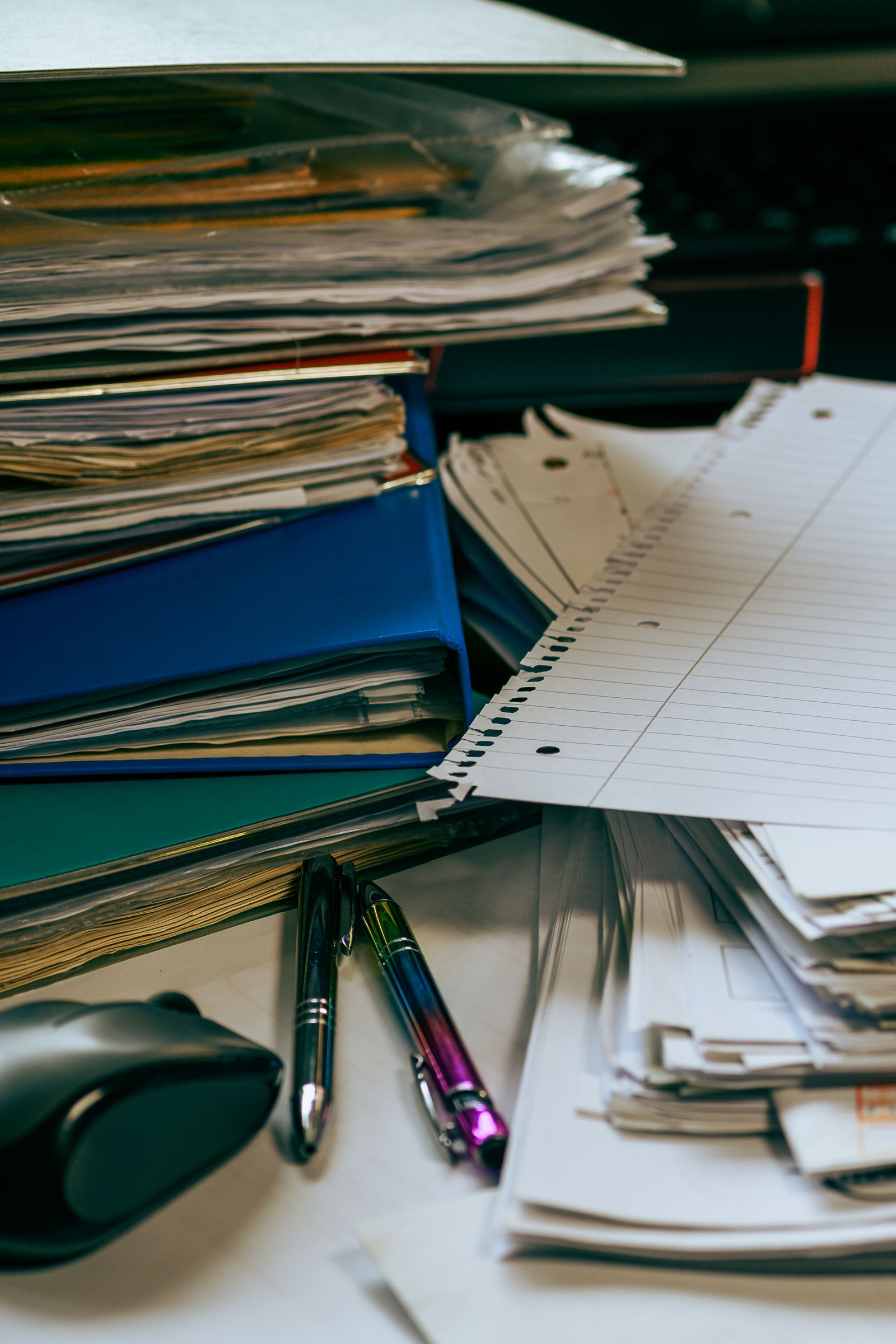 Neat desk with stacked paper and folders