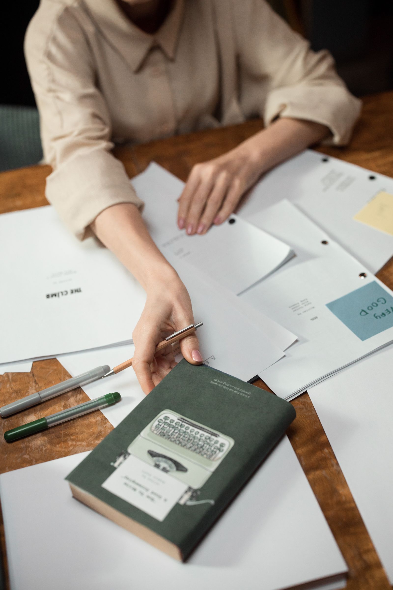 Hands sorting envelopes and documents