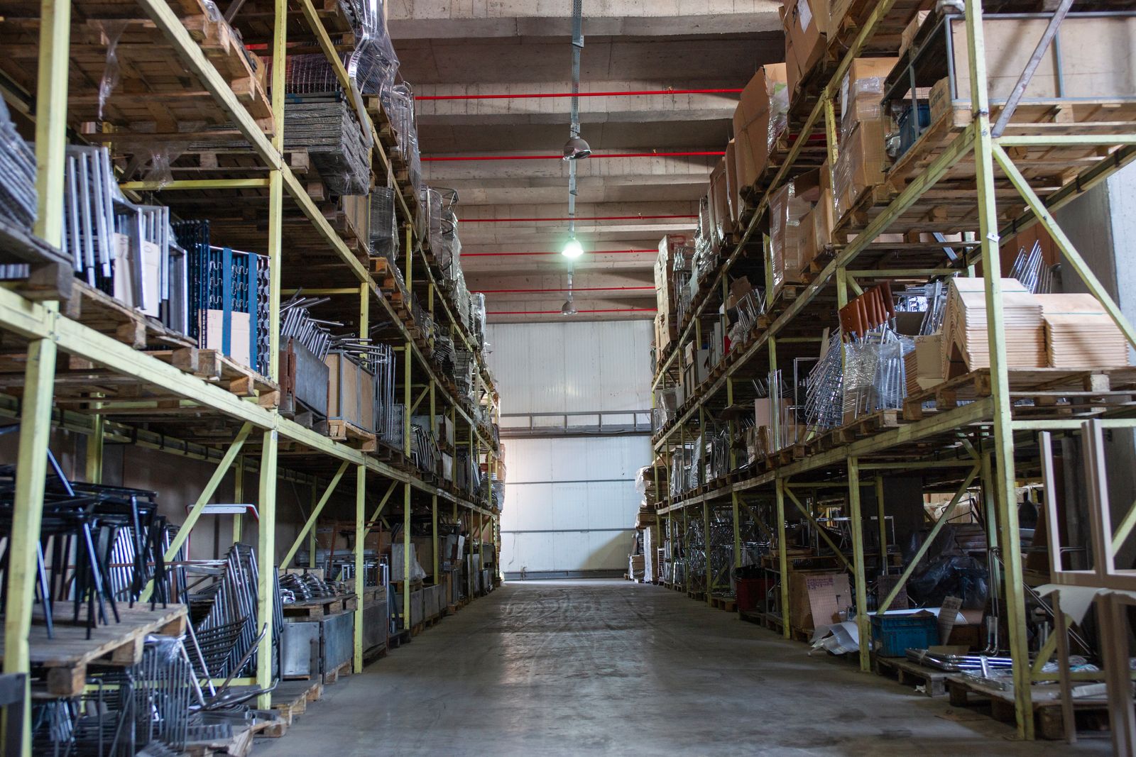 Wide aisle between industrial storage racks